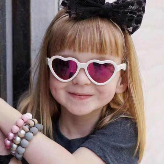 Pink heart-shaped sunglasses for children 