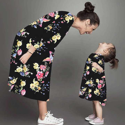 Elegant black dress with a fashion design, matching clothes for women and mothers 