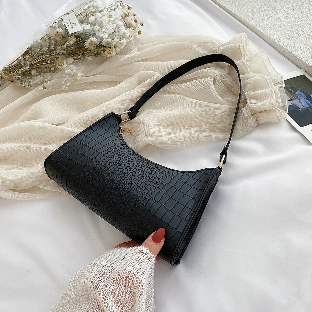 Elegant women's handbags made of PU leather with snakeskin print