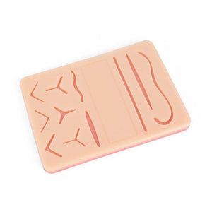 Suture with 11 pre-cut wounds and mesh under first aid 