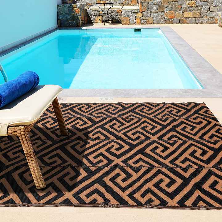 Plastic straw mat for outdoor activities. 
