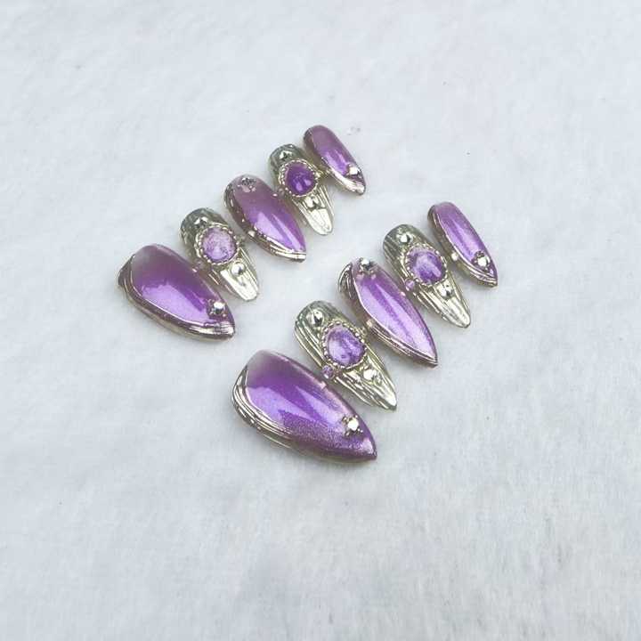 Handmade almond-shaped nails in purple 