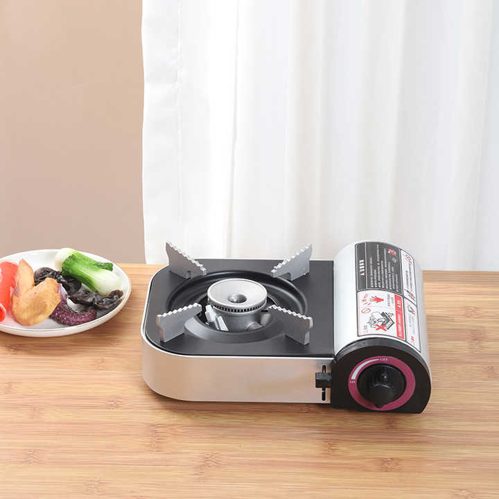 موقد غاز صغير محمول للتخييم والسفر مزود بهيكل . Portable Mini Gas Stove for Camping and