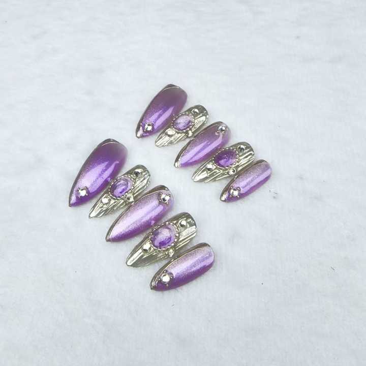Handmade almond-shaped nails in purple 