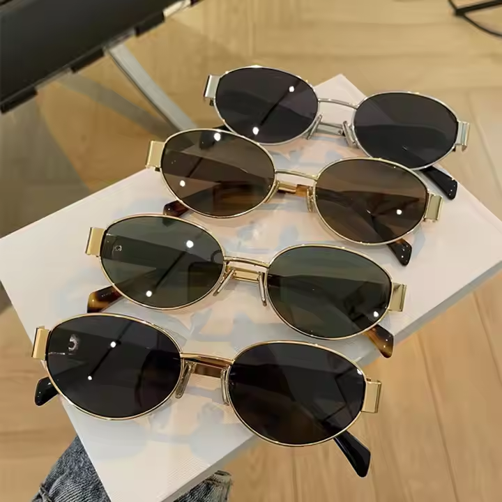 Fashionable oval women's sunglasses wholesale luxury custom summer sunglasses for women fashion metal frame 