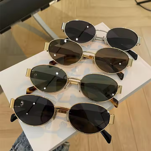 Fashionable oval women's sunglasses wholesale luxury custom summer sunglasses for women fashion metal frame 