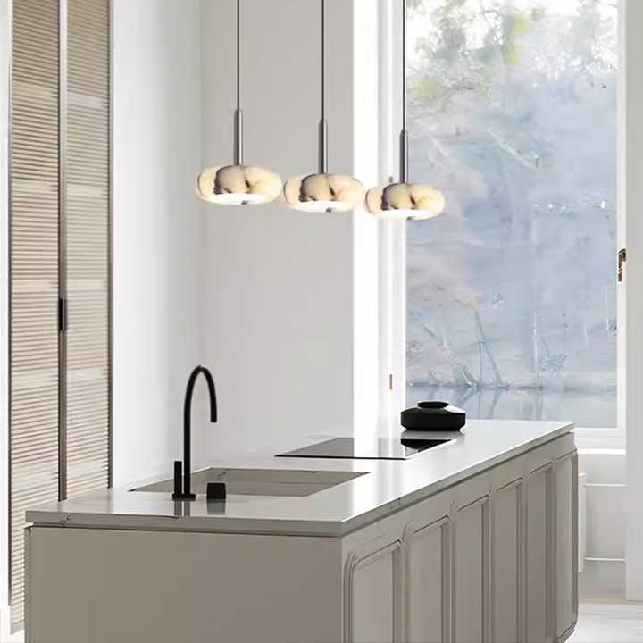 Modern stone chandelier lamp next to 