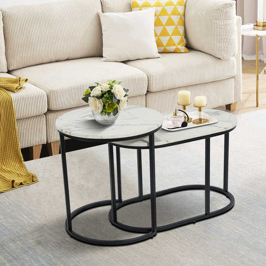 Nesting of two modern round white marble wood tables, black metal frame, oval top and black leg 