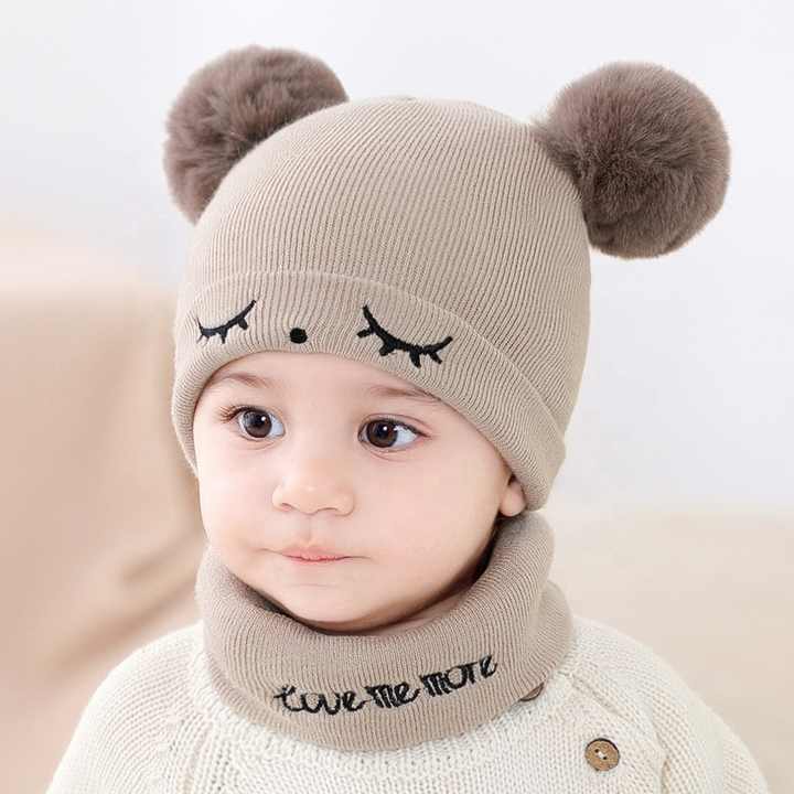 Small baby hats embroidered with eyes 