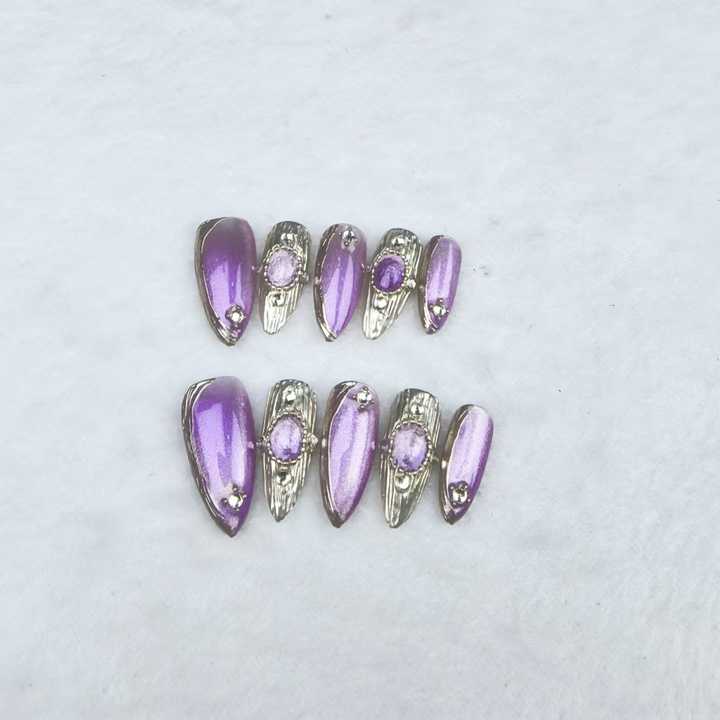 Handmade almond-shaped nails in purple 
