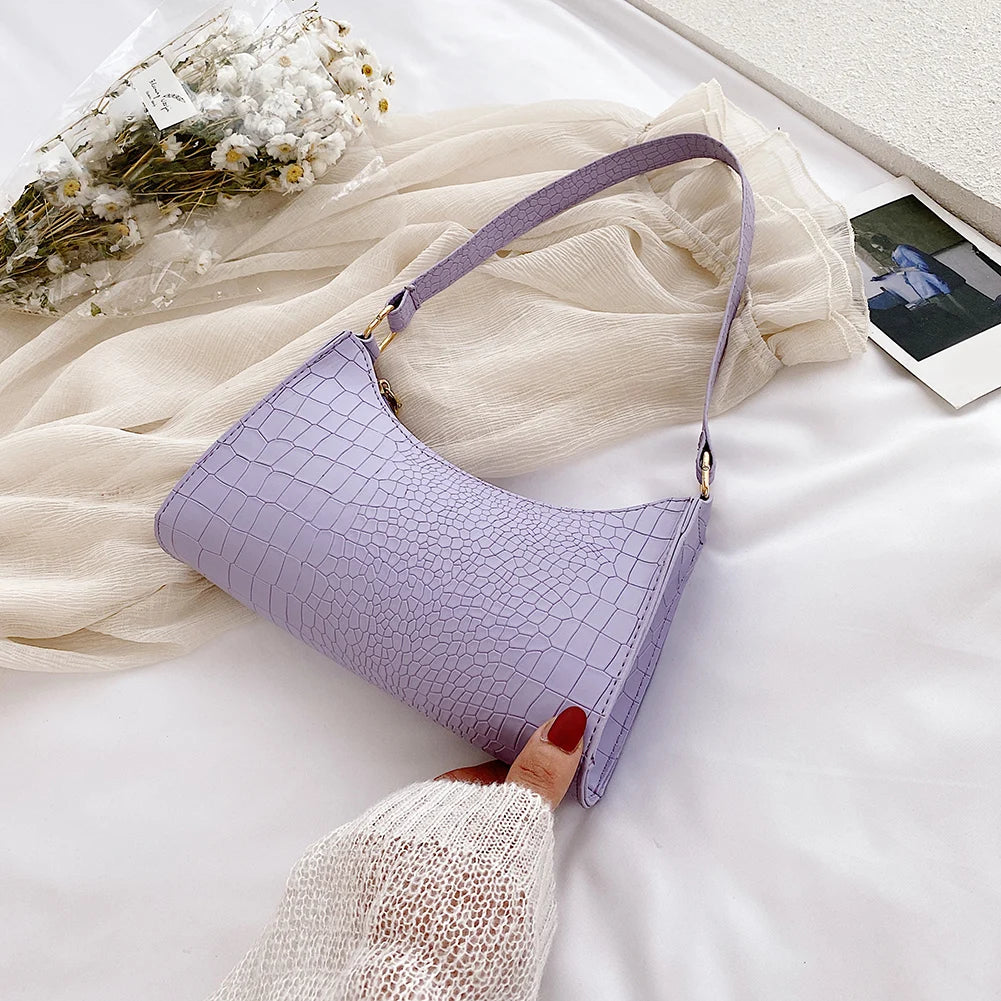 Elegant women's handbags made of PU leather with snakeskin print