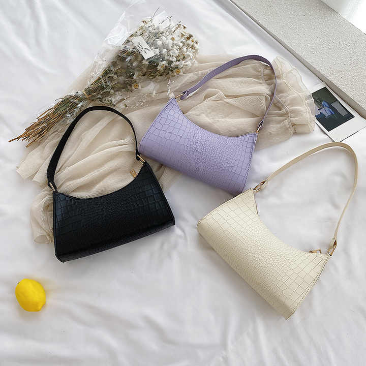 Elegant women's handbags made of PU leather with snakeskin print